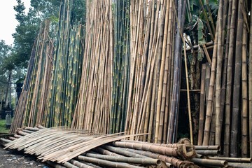Piles of bamboo poles in a factory