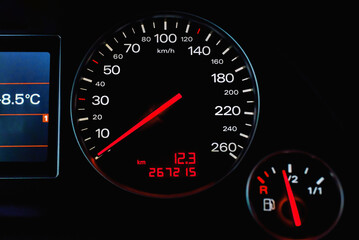 Car's dashboard.Modern car dashboard panel at night time.Closeup,selective focus.