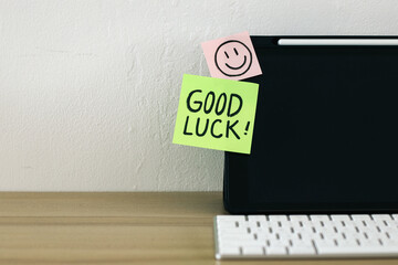 Good Luck text written on paper notes on a work desk