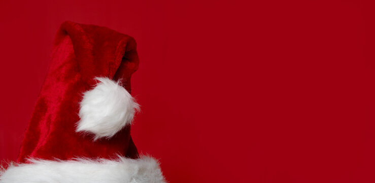 red christmas hat on red background