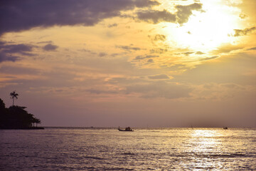 Naklejka na ściany i meble sunset on sea with boat