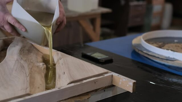 A detailed resin work process, merging art with carpentry. Reflects the growing interest in functional art pieces.