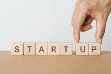 hand completed start up word on wooden cube block for business start up concept