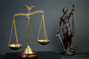 Lady justice. Statue of Justice, scales on a wooden background. Legal and law concept.