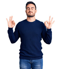 Young handsome man wearing casual clothes relax and smiling with eyes closed doing meditation gesture with fingers. yoga concept.