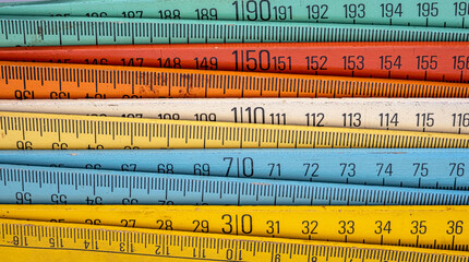 Old wooden folding meter ruler measuring centimeters