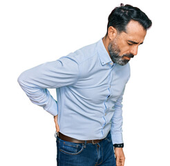 Middle aged man with beard wearing business shirt suffering of backache, touching back with hand, muscular pain