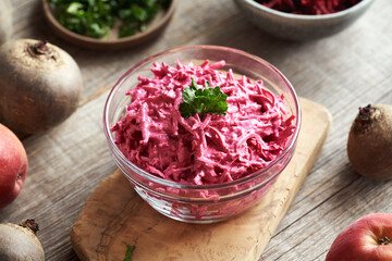 Vegetable salad made of fresh beetroot, apples and sour cream
