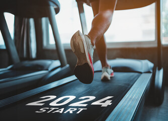 Happy new year 2024,2024 symbolizes the start of the new year. Close up of feet, sportsman runner...