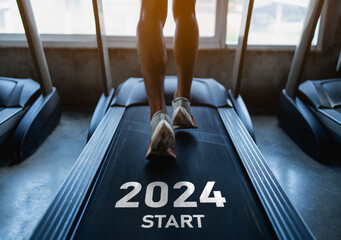 Happy new year 2024,2024 symbolizes the start of the new year. Close up of feet, sportsman runner running on treadmill in fitness club. Cardio workout. Healthy lifestyle, guy training in gym. - obrazy, fototapety, plakaty