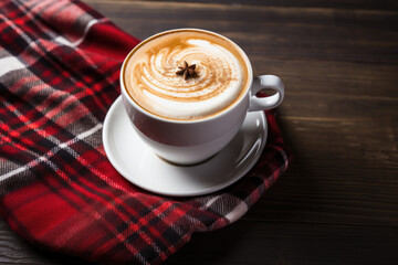 Christmas cup of coffee, red plaid background 