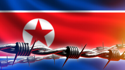 North Korea flag. Barbed wire. Concept sanctions and restrictions. Metaphor ban on leaving state....