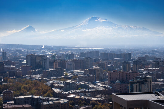 Summer in Armenia. City Yerevan. Residential area from bird eye view. View Yerevan with mountain in distance. Armenia view from quadcopter. Yerevan on sunny day. Vacation in Armenia. Travel, tourism