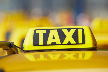 Taxi - Replica of an old yellow and lemon bus - yellow taxi sign