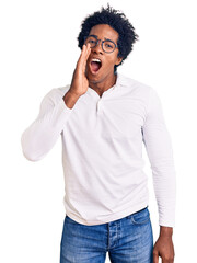 Fototapeta na wymiar Handsome african american man with afro hair wearing casual clothes and glasses hand on mouth telling secret rumor, whispering malicious talk conversation