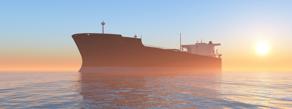 Frachtschiff bei Sonnenaufgang