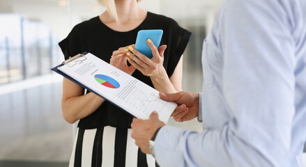 businessmen man and woman study documents use laptop
