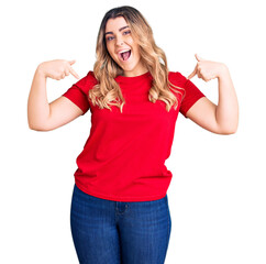 Young caucasian woman wearing casual clothes looking confident with smile on face, pointing oneself...