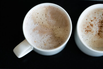 Cup of aromatic hot coffee in a white cup
