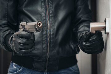 an armed criminal with a dhrt pistol enters the premises. Attempted robbery. Crime concept. bank...