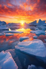 the sun is setting over icebergs in the ocean