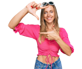 Beautiful caucasian woman wearing sunglasses and summer style smiling making frame with hands and fingers with happy face. creativity and photography concept.