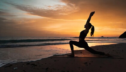woman doing yoga on the beach at sunset