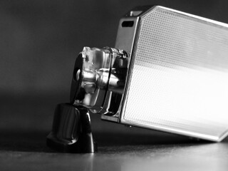 The electronic cigarette device is very close, black and white image