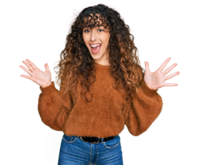 Young hispanic girl wearing casual clothes celebrating victory with happy smile and winner expression with raised hands