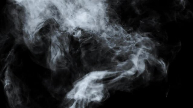 Abstract white smoke in slow motion. Smoke, Cloud of cold fog in light spot background. Light, white, fog, cloud, black background, 4k, ice smoke cloud. Floating fog.