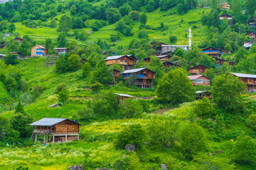 Houses in green highlands wonderful views surrounded by clouds and mountains the idea of ​​living in nature