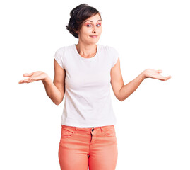 Beautiful young woman with short hair wearing casual clothes clueless and confused expression with...