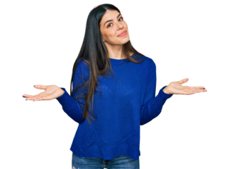 Young hispanic woman wearing casual clothes clueless and confused expression with arms and hands raised. doubt concept.