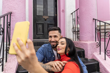 adult couple taking a selfie celebrating valentine's day on their trip to london