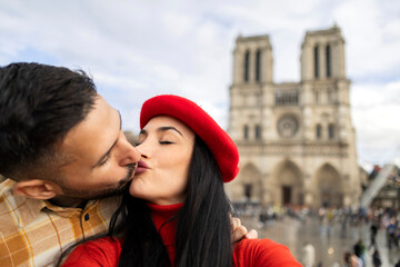 Valentine's Day kiss from a young adult couple in Paris
