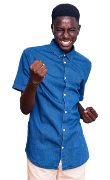 Young african american man wearing casual clothes celebrating surprised and amazed for success with arms raised and eyes closed. winner concept.