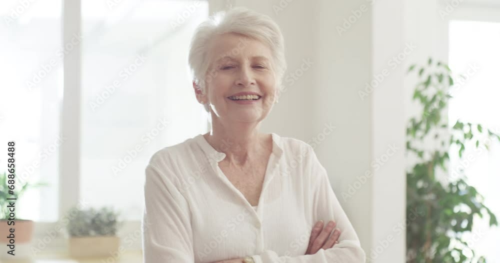 Poster Happy, senior woman and arms crossed in home with pride and freedom in morning of retirement, holiday or vacation. Elderly, portrait and lady relax in kitchen, living room or house with sunshine