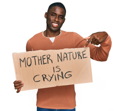Young african american man holding mother nature is crying protest cardboard banner smiling happy pointing with hand and finger