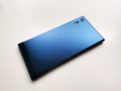 Back side of cobalt blue smartphone mockup isolated on white background