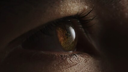 Naklejka premium Macro shot of eyes with fireworks reflection. New Year and Christmas holiday concept.