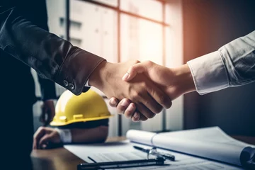Foto op Plexiglas A moment of collaboration takes center stage as real estate agents and customers shake hands in a construction site office with yellow safety helmets on the desk. Generative AI. © Surachetsh