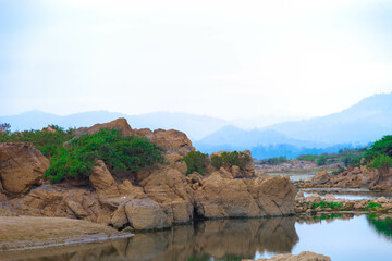 Fototapeta na wymiar Photo rapid current of the chuya river in mountains. summer time. rocky coast. huge boulders.