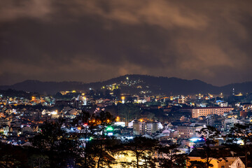 View on roofs in the city of Dalat. Da Lat and the surrounding area is a popular tourist destination of Asia. City with fogs and mountains