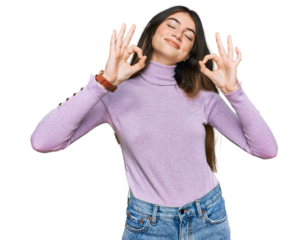 Young beautiful teen girl wearing turtleneck sweater relaxed and smiling with eyes closed doing meditation gesture with fingers. yoga concept.