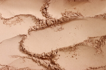 Background of brown sandy powder. concept of beauty, texture and cosmetics mock up