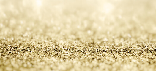 Abstract gold glitter sparkle with bokeh background