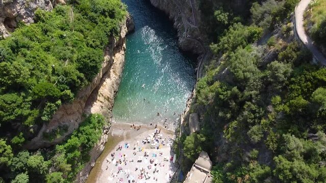 The Fjord of Furore: the iconic beach under the bridge on the Amalfi Coast, Italy-Drone footage fly over
