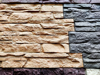 Stylized stone or brick plastic wall of different colors. Abstract Background, Texture, Pattern, frame, place for text, copy space