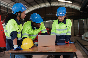 Group of engineer and technician workers video calling, online meeting via laptop computer in the industry factory