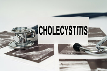 On the ultrasound pictures there is a stethoscope and a business card with the inscription -...
